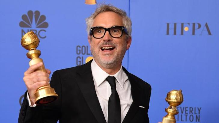 alfonso-cuaron-posa-com-globo-de-ouro-1546832908414_v2_750x421